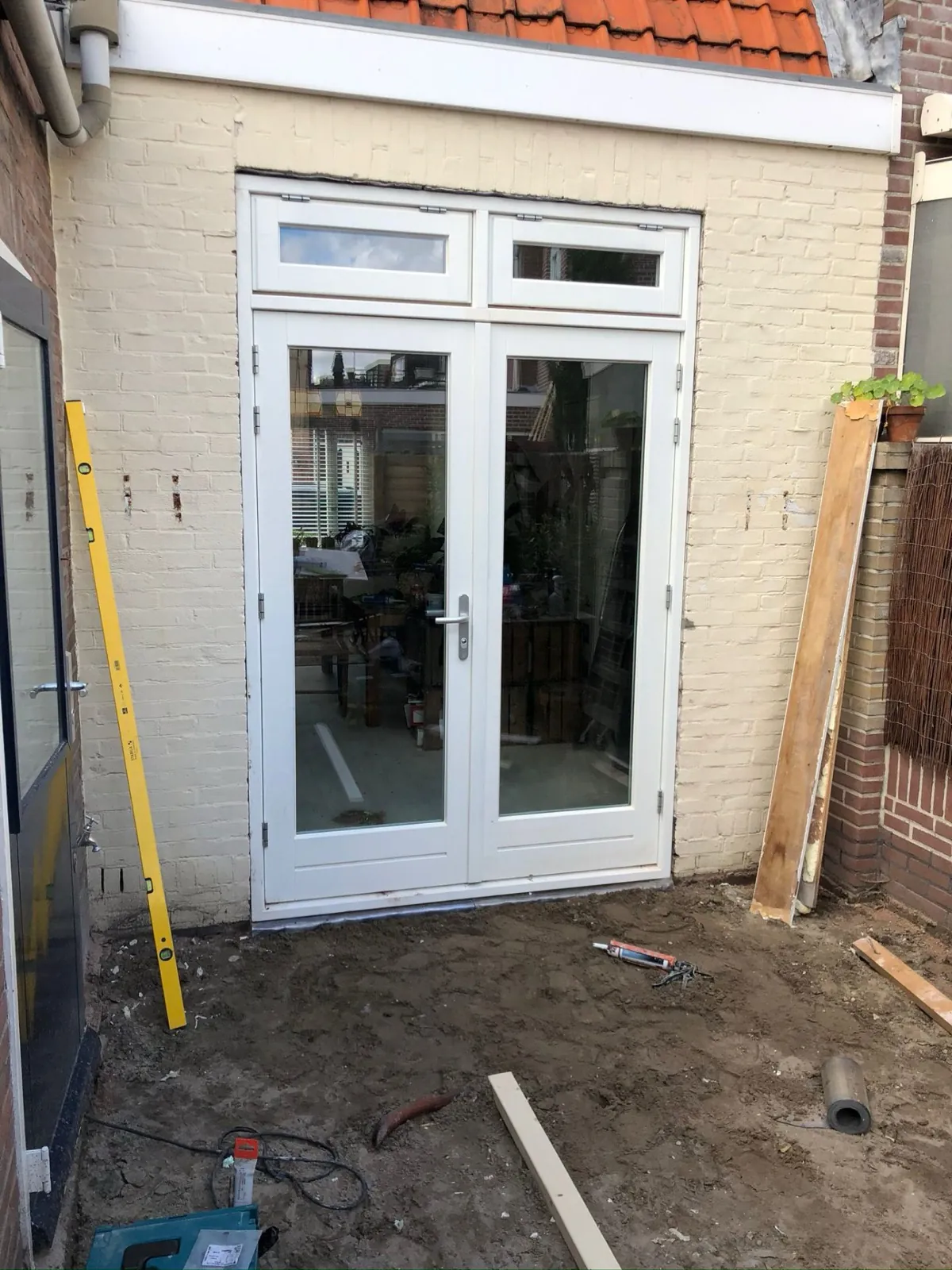 Franse tuindeuren met bovenlicht, geplaatst in een woning in Haarlem